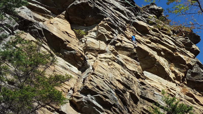 Brian heading up into the steep finger buckets and mantle finish.
