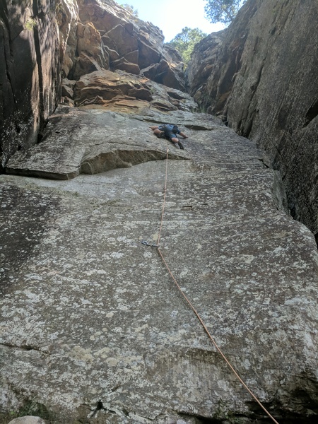 Jeff nervously works the 2nd crux. After this the route backs way off and it's cruiser to the top.