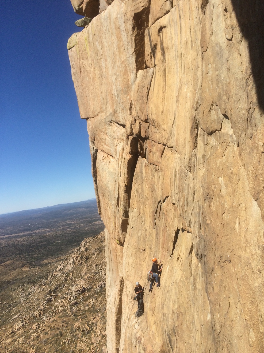 Isiah on the delicate traverse up and over from the belay ledge for P4