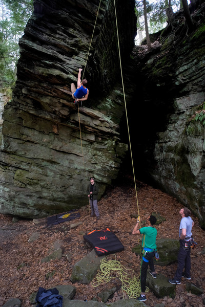 Dual belay rig on the prow.
<br>
Crash pad between the two belayers to cover the big rock is helpful.