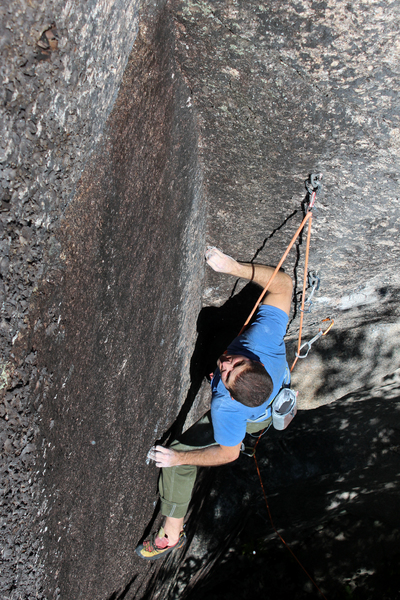 Tim inspects the crux. The hand s are SMALL... the feet are smaller...