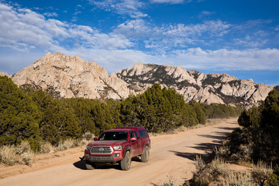 Driving out of the area, utilizing a tripod and remote trigger. High speed selfies.<br>
Never Never Land is above the truck on the left, Rock Corral is on the far right