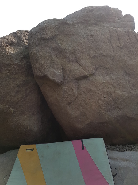 one of the first boulders to your left when you have reached the river bank