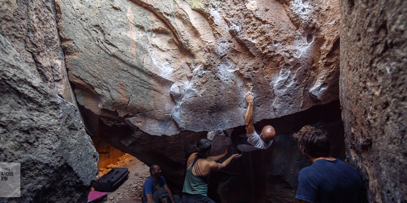Sticking one of several reachy moves on the "Mothership Connection", V4, in Sads. The wide angle lens undermines just how narrow this space is.