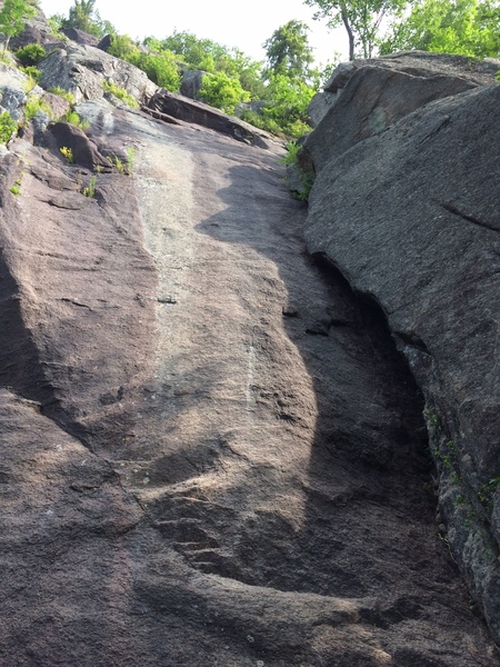 Looking up at the P1 slab. The attractive corner to the right is Hangover Corner (5.4)