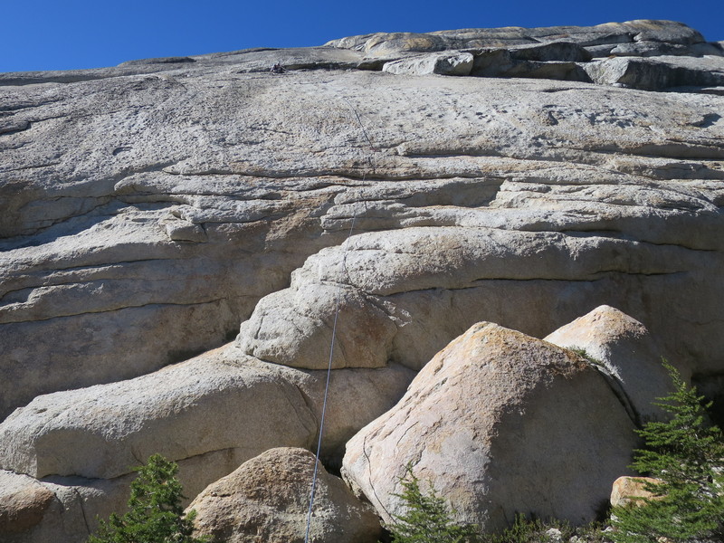 Use gear for belay in cracks under small roof.