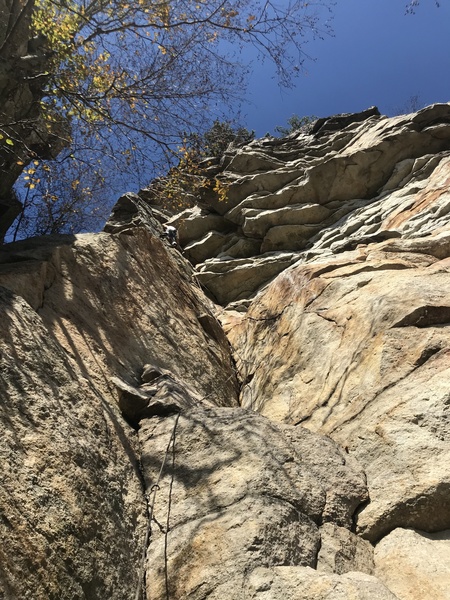 Russ Clune enjoys a perfect fall day at Skytop on the crux moves of Taste of Honey.