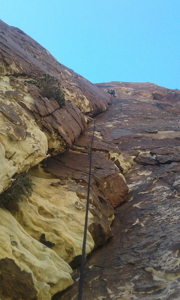 Headed up the crux pitch. Sustained 5.9 climbing with a short, well protected 5.10 move at the top.