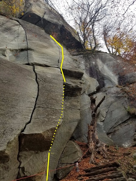 The upper crack on Leoni.  The crack is too thin to climb, and instead uses a series of horizontals and some face holds.  The beautiful crack to the left is "Mustang" an 8a.