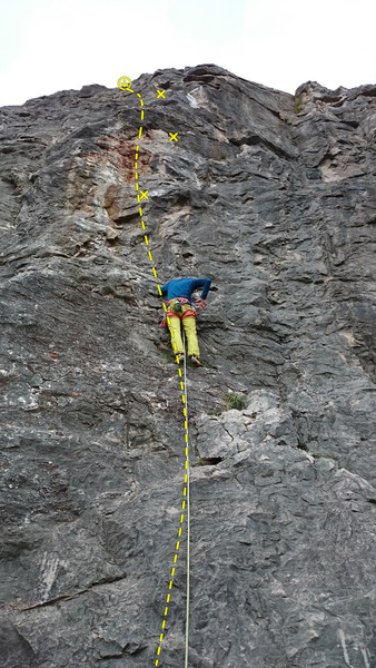 Attila clipping the 1st bolt. The route is easily located by the rust-coloring in the middle.