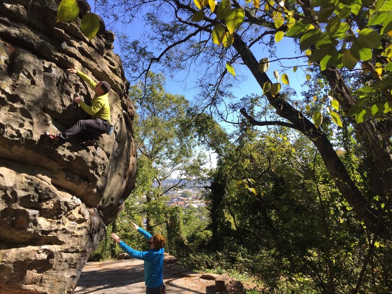 Climbers enjoying a great fall day on the Cliffhanger Boulder, finishing up the "Cliffhanger" boulder problem (v0-1).