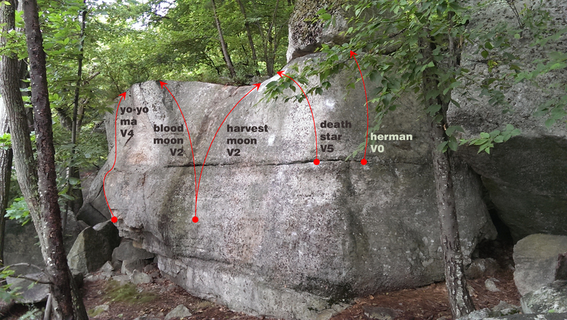 Herman starts around the right corner of the boulder and climbs straight up.