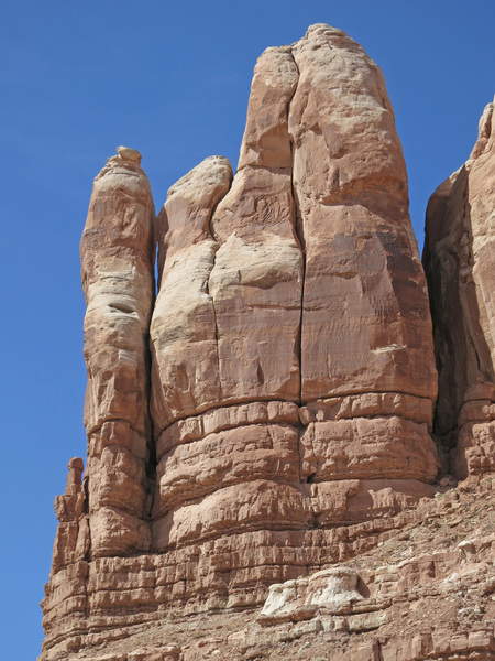 A close up view of Trident Tower from the main wash in Roundhouse Canyon. The route can't be seen, but starts out of the cleft on the right side of the tower.