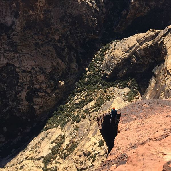 Looking down at the crow's nest belay ledge from the final pitch.