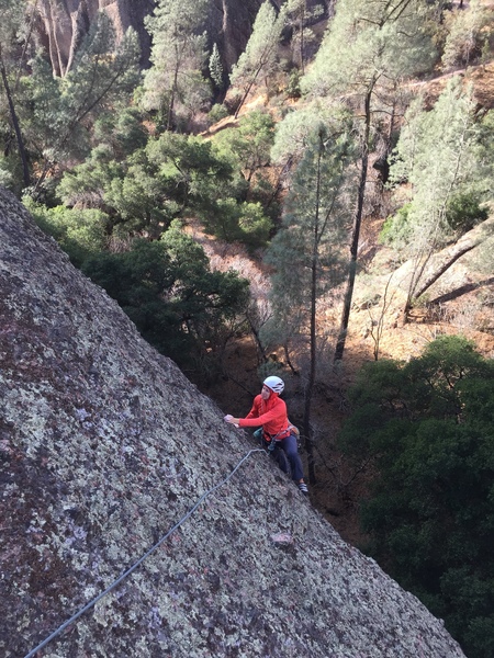 Hilary B approaching the P2 anchor on Machete Direct. It is easy to link the first two pitches.