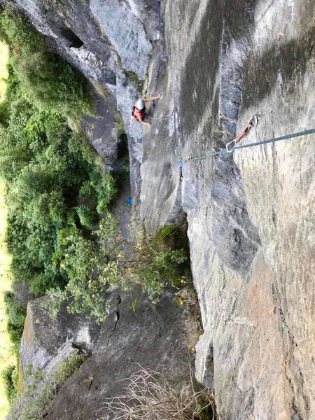 Looking down from the top of Get a Job. The climber is at the belay ledge atop pitch 1.