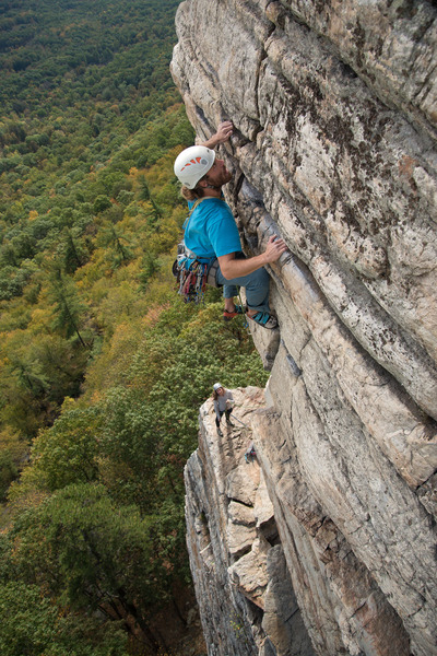Nick pulling just after pulling "the move", with Becca at the belay.