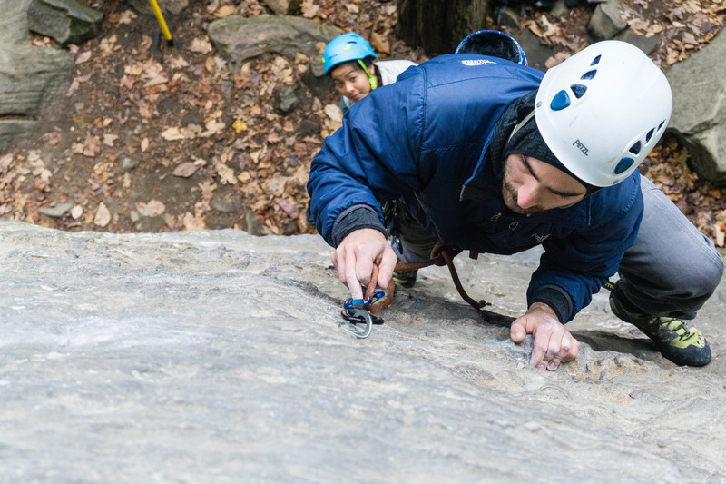 A careful watch of the belayer with a new leader.
<br>
<br>
by Dalton Johnson www.daltonjohnsonmedia.com