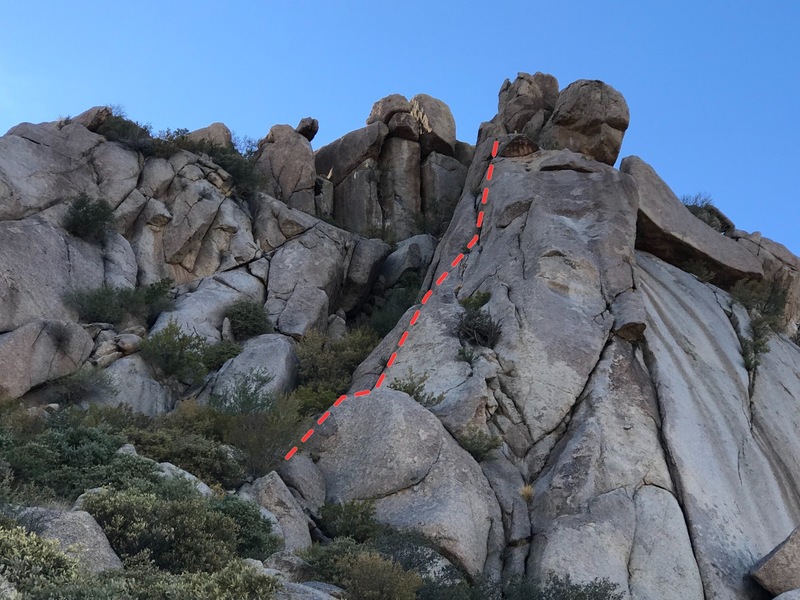 White on starts on top of the ledge (accessed from a trail to it's left) and follows a discontinuous crack system to the left of the vegetation shown in about the middle of the buttress. Beat Feet can also been seen here on the right side of the buttress.