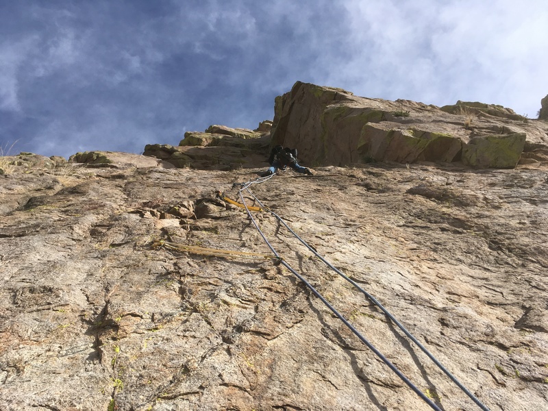 Forrest Wilcox leading the crux of the route on P2. The first piece of gear clipped here is an old rusty bolt.