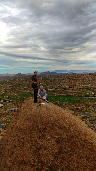 You can step onto AMC boulder from the top. The move is to the right and down a little, one 5.8 move around the aerate and a couple steps.