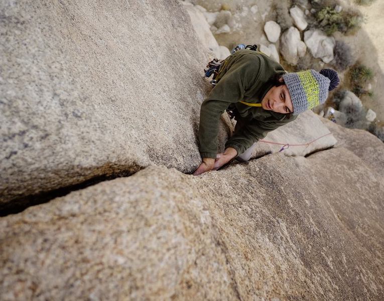 “Shar enjoying generous crack at the top of Apparition. Another 20' of of crack and this line would be a blue ribbon.”