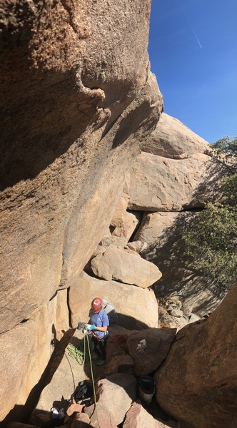 Route overhangs gently. A. Nachman at the base, in the belay nook.