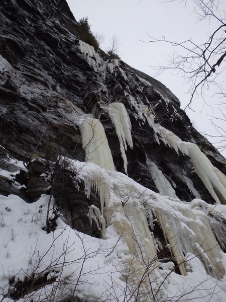 Start of the route. Climb left ice then traverse right to dangler, up the corner to more ice and a belay below a small tree and an obvious crack above.