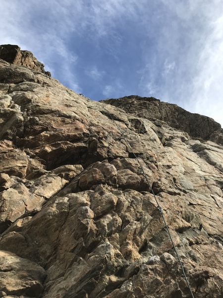 A shot from the ground, notice the high second bolt. It is very easy climbing to there.