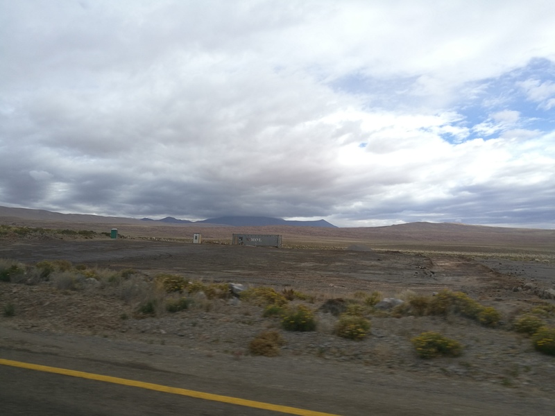 picture from main road to container. behind the container is the road to the parking lot for the canyon.