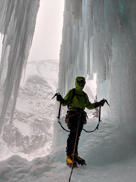 The belay at the top of the second pitch is bolted and is behind the waterfall curtain. The exit to start the third pitch is out the window (right side of picture). Vik Sahney about to lead P3. Taken on 2/3/2018