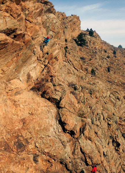 Climbing through the overhanging section.