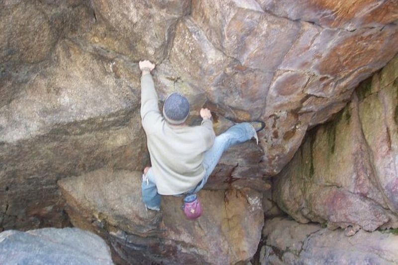 Climbing in Cave Boulder, a. NorthWest