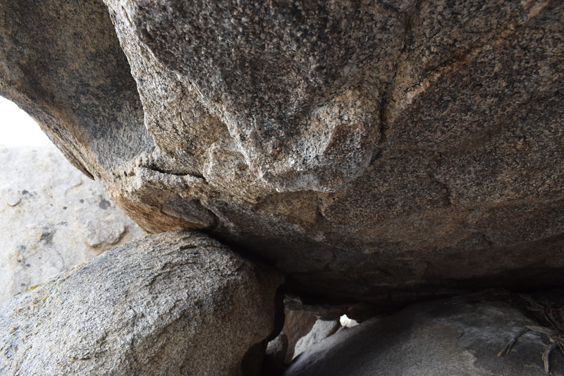 The right hand starting hold under the roof.