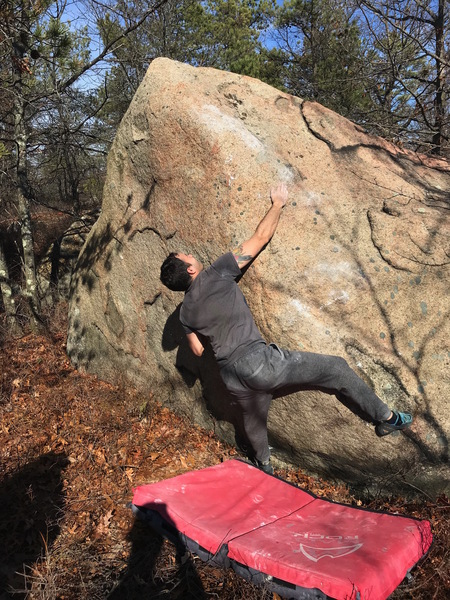 Luis reaching for the first hold (definitely the crux if you're short... probably will feel more like V5).... It's far if you're not tall!
