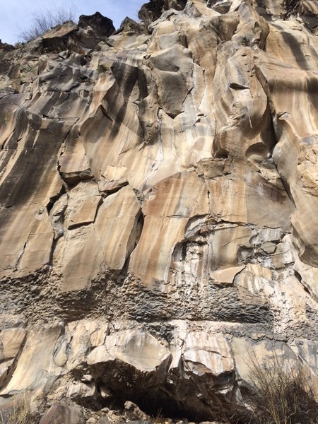 The White Wall "Power Spot"; a large inverted half-sphere section of the crag with two routes (Sage Against the Machine & Tatanka Blanca) within the sphere and Hocus Focus to the left.