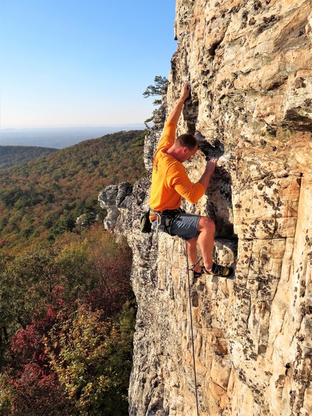 Dennis Buice moving above his gear into the upper crux.