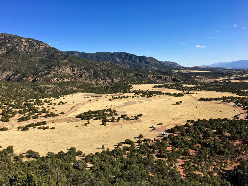 Sand Gulch access road and camping area (lower right) and access road for The Bank campground and parking area (left). The photo was taken facing southeast from just off the access trail to the Free Form Wall.