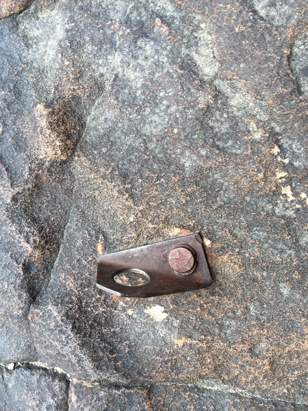 Neat old bolt (star drive in?) on climber's left of the ledge before the final little squeeze ramp