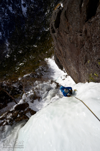 Loren climbing the bulge after the crux wall on PG-13.