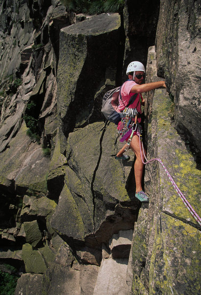 Chuck Timchalk on the sketchy crux pitch - Aug 1995. Notice recent rock fall below him.