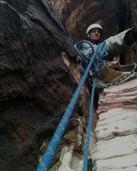 Belaying beneath the big overhang on Working Class Heroes
