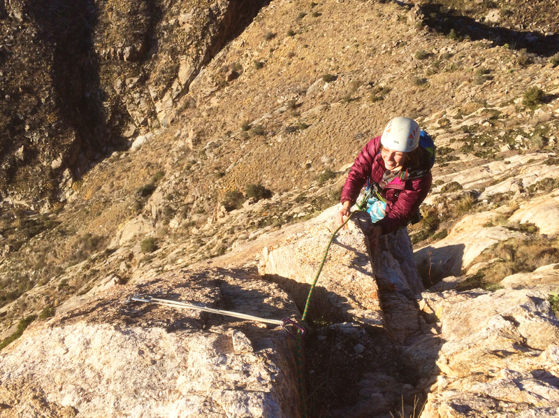 Allie Burnett topping out on the first ascent.