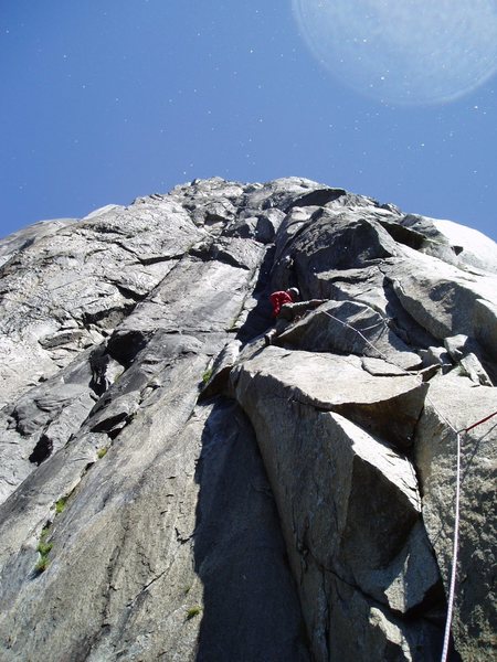 John Steiger on off-width variation of pitch 9. The easier way (see Fish Topo): climb the face at bottom middle of the photo. Note the "rain" from Horsetail falls is starting, which soaked the pitch by the time I followed.
