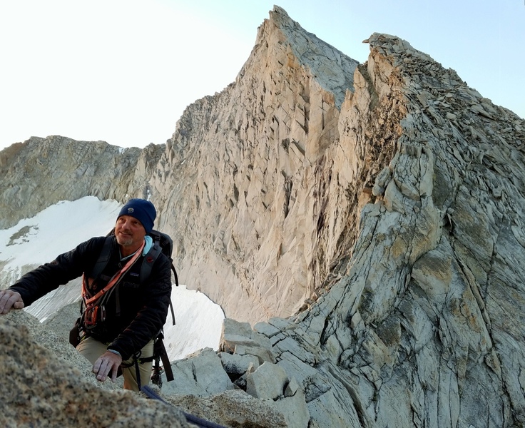Posing with the awe-inspiring ridge traverse of Conness' North Ridge behind.