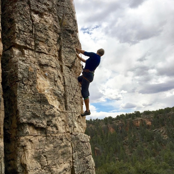 Sibylle toproping One Tough Waterjug, 5.9, on a breezy April day.