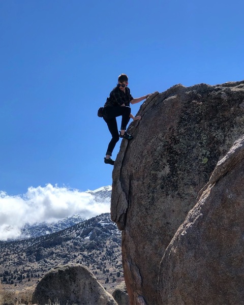 Unknown climber topping out on The Prow.