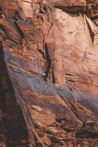 At the top of the climb under tall vertical cliffs.