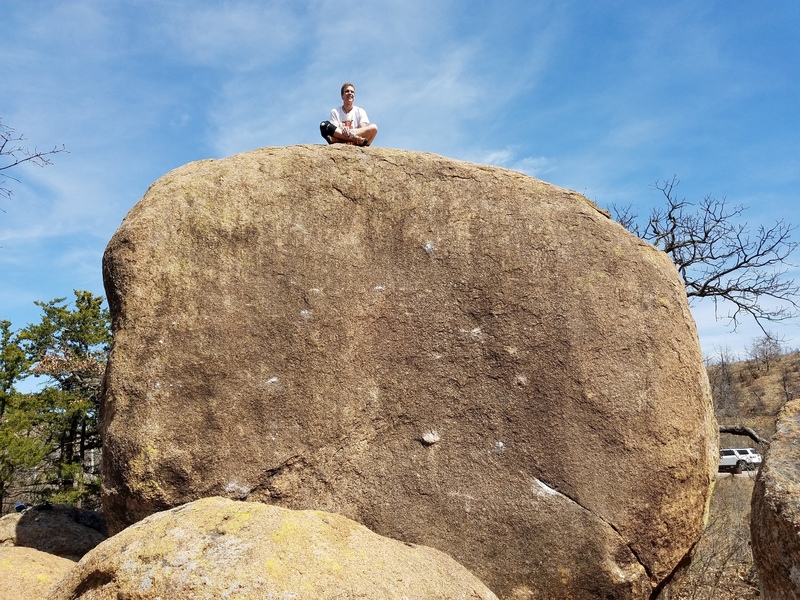 Preston Pettigrew atop Steak Dinner Boulder for scale