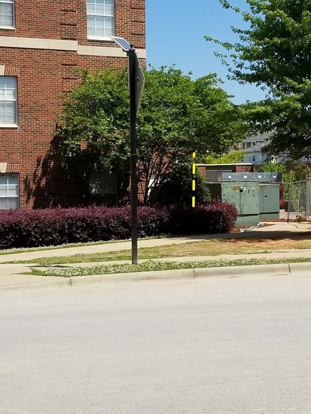 Garbage Ladder on the right end of the building behind the trees. Excellent picture